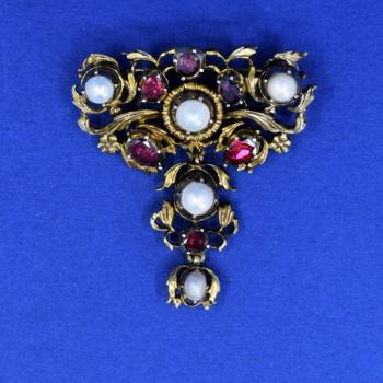 Silver brooch in baroque style
