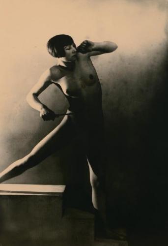Nude female with conductors stick