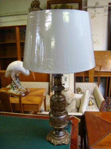 A pair of antique brass lamps