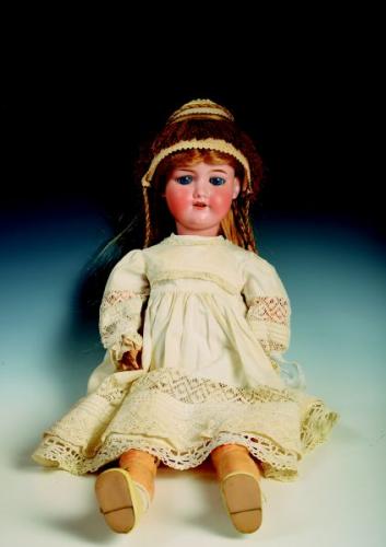 A doll with a porcelain head