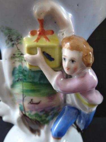 Vase with a boy with a gift