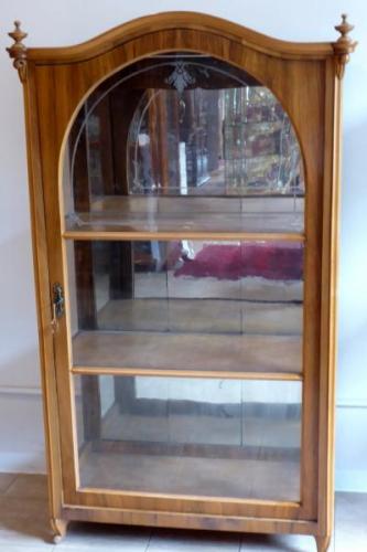 Walnut showcase, with arch and etched glass