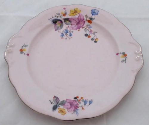 Pink plate with colourful flowers